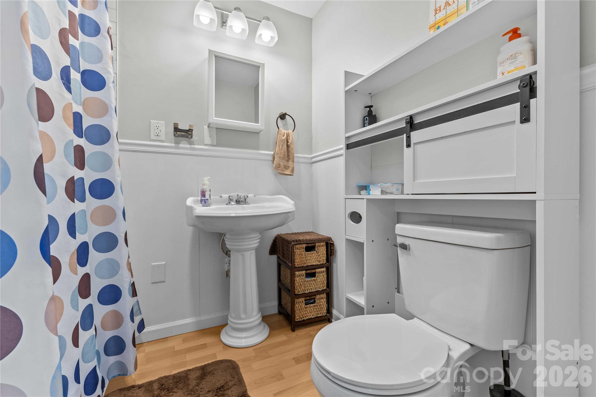 2341 Dixon Road Belmont, NC 28012 - Photo 28 of 42 a bathroom with a sink a toilet and a mirror