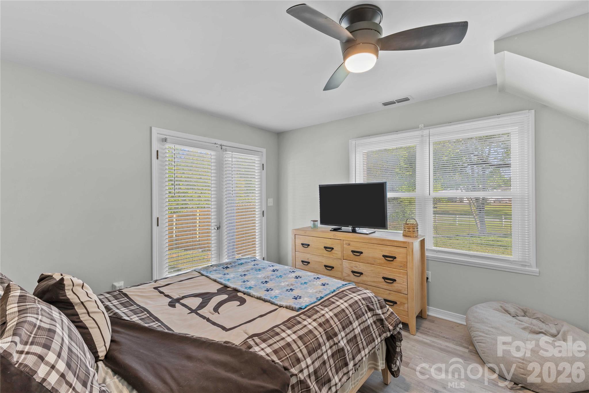 2341 Dixon Road Belmont, NC 28012 - Photo 29 of 42 a bedroom with a bed and a flat screen tv