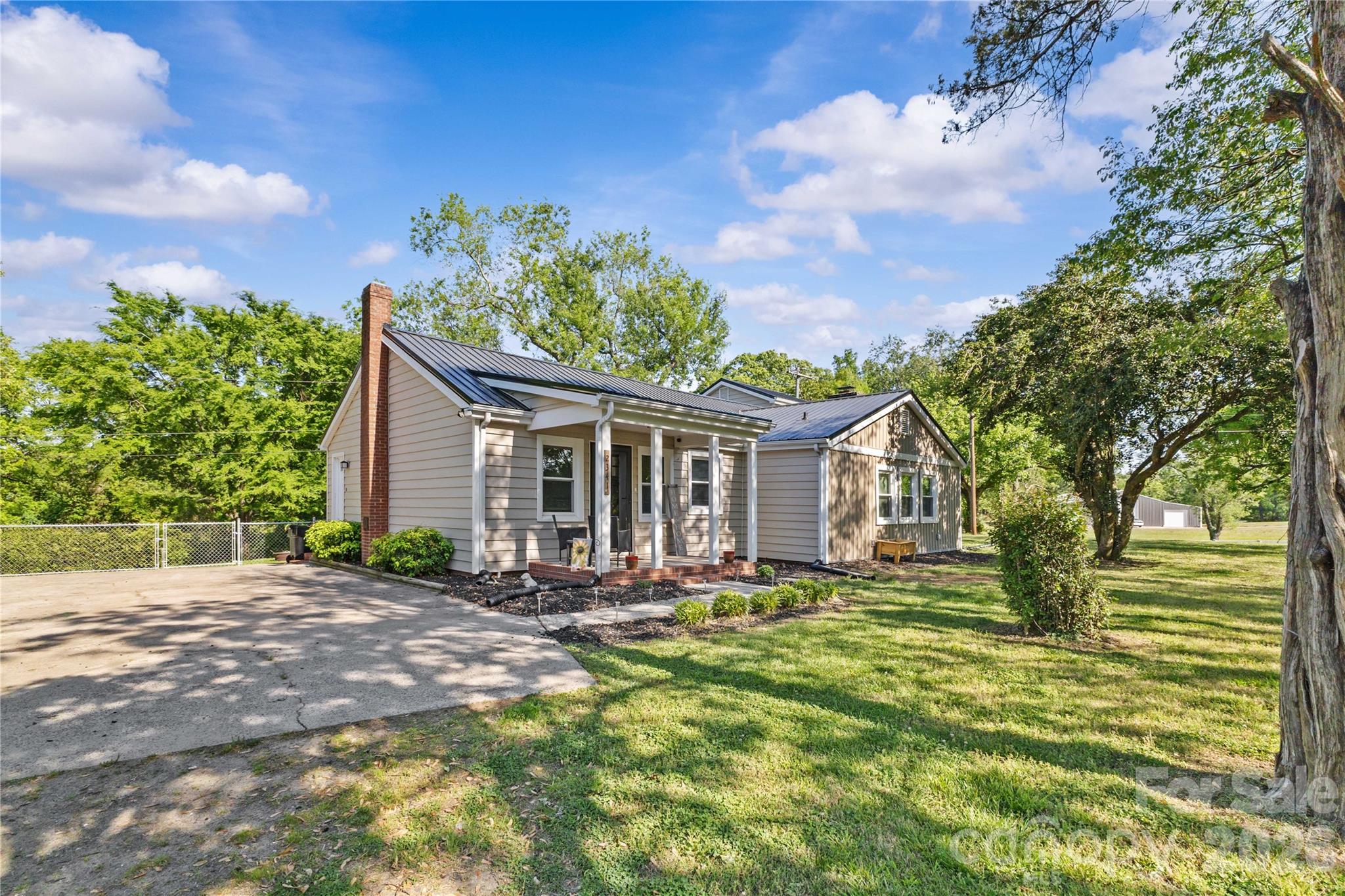 2341 Dixon Road Belmont, NC 28012 - Photo 3 of 42 a front view of a house with a yard