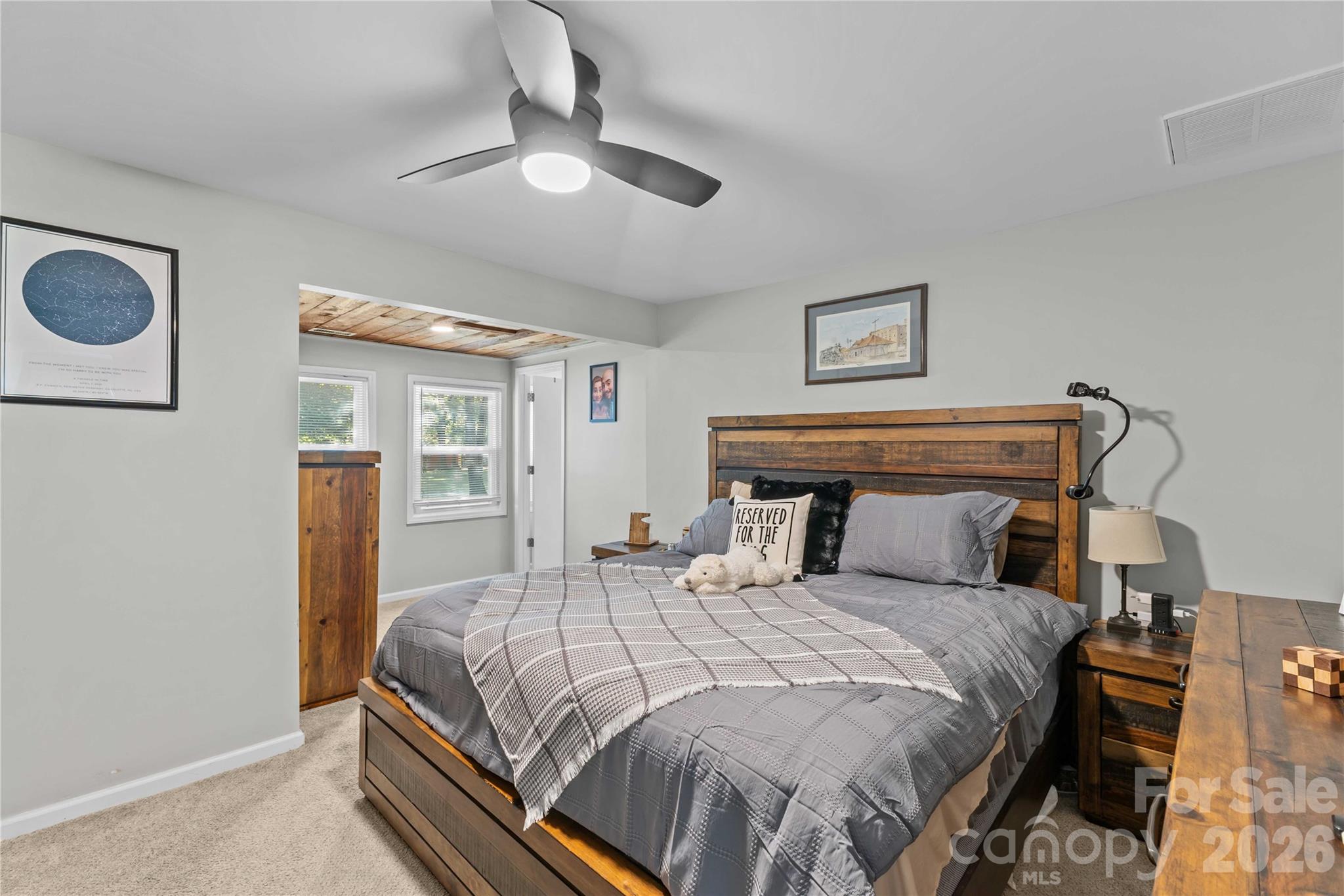 2341 Dixon Road Belmont, NC 28012 - Photo 31 of 42 a bedroom with a bed and a chandelier