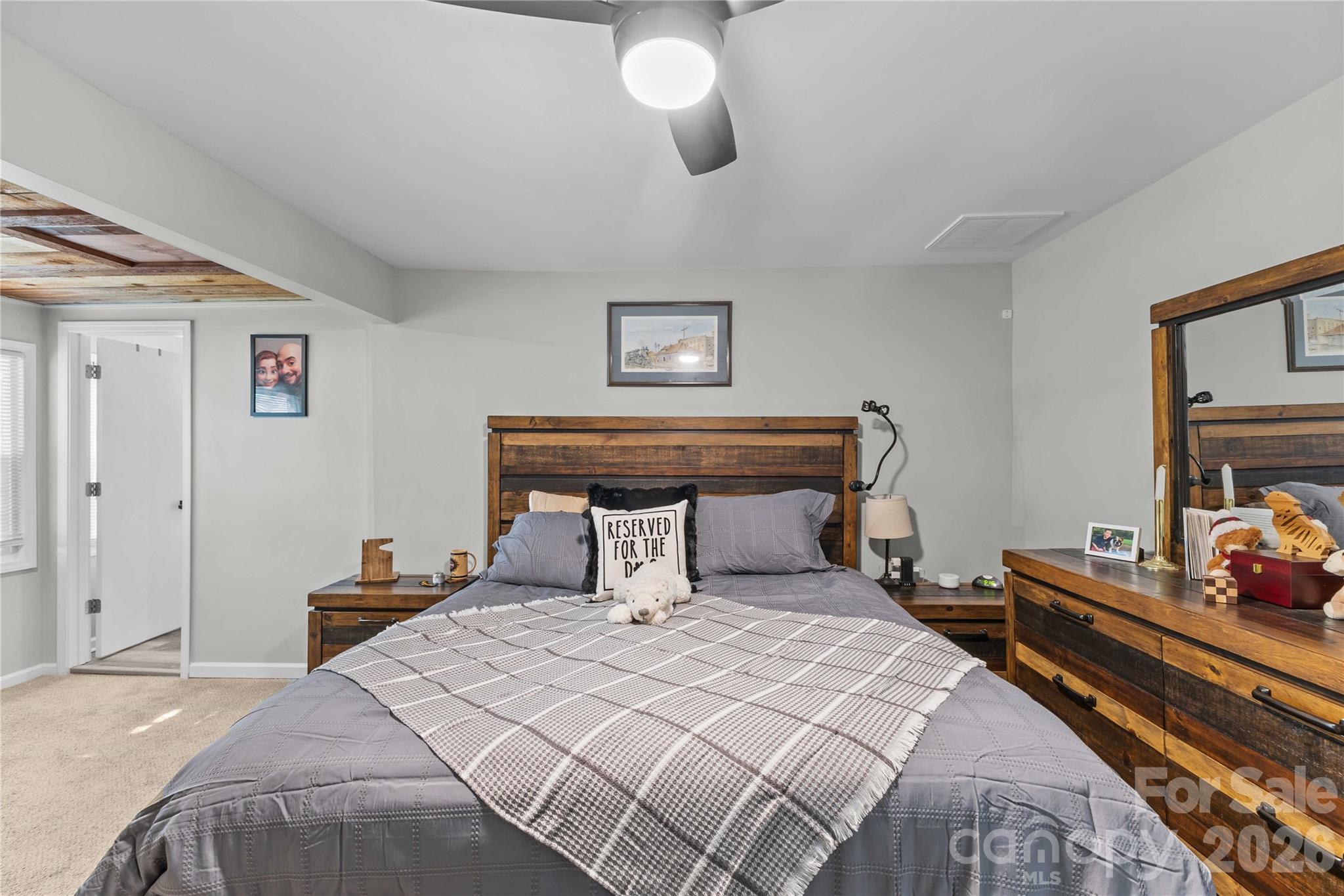 2341 Dixon Road Belmont, NC 28012 - Photo 32 of 42 a bedroom with a bed and wooden floor