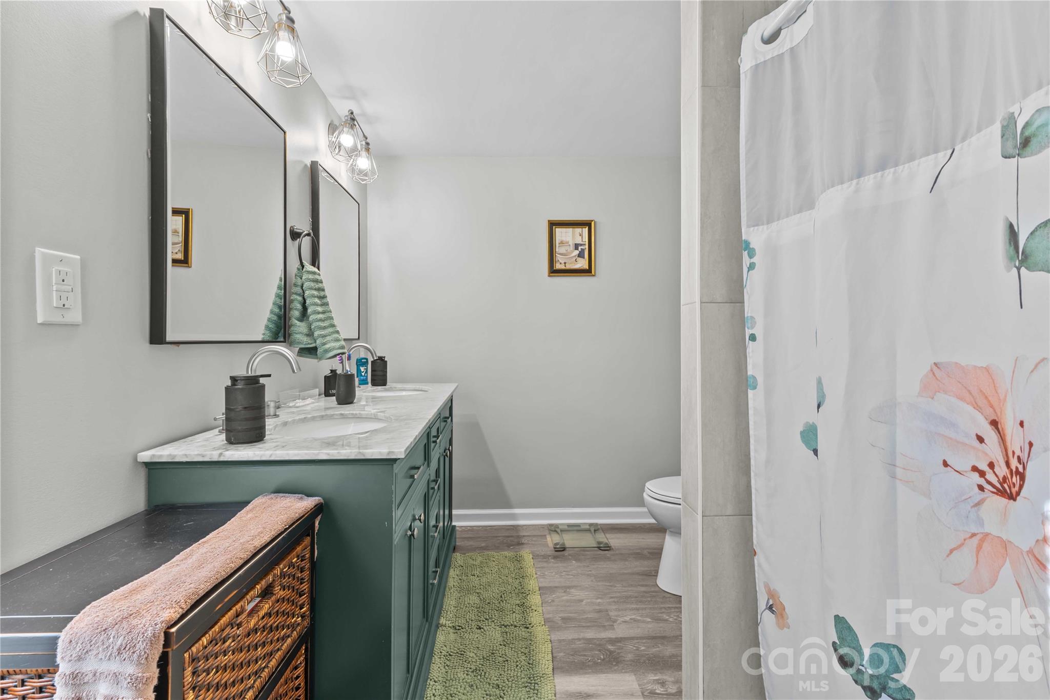 2341 Dixon Road Belmont, NC 28012 - Photo 34 of 42 a bathroom with a sink a toilet and shower