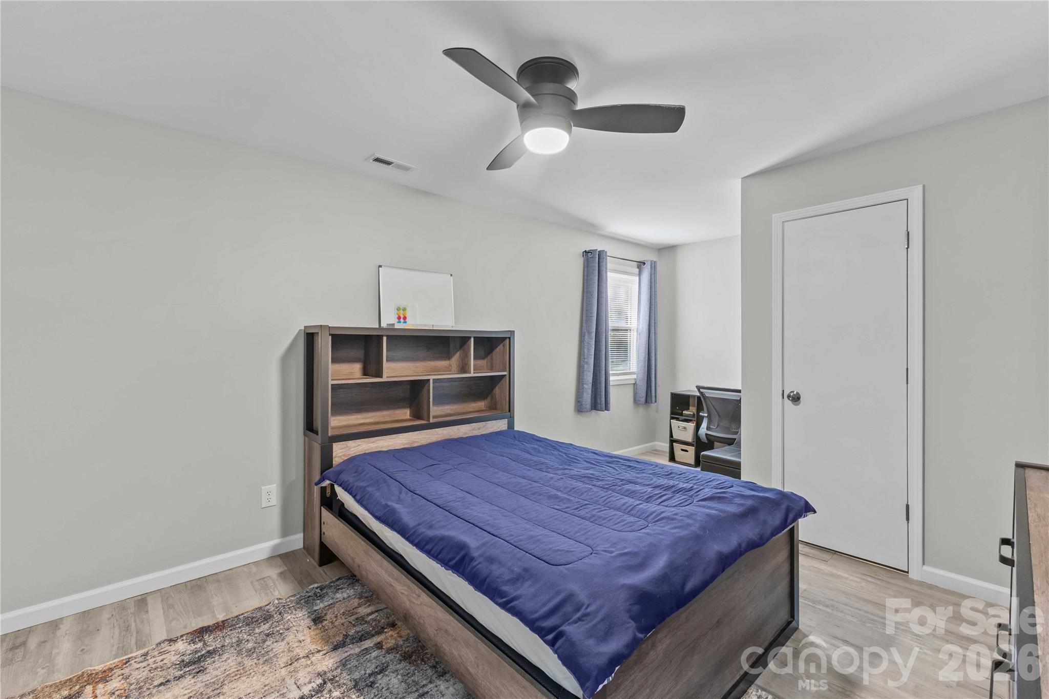 2341 Dixon Road Belmont, NC 28012 - Photo 40 of 42 a bedroom with a bed and a ceiling fan