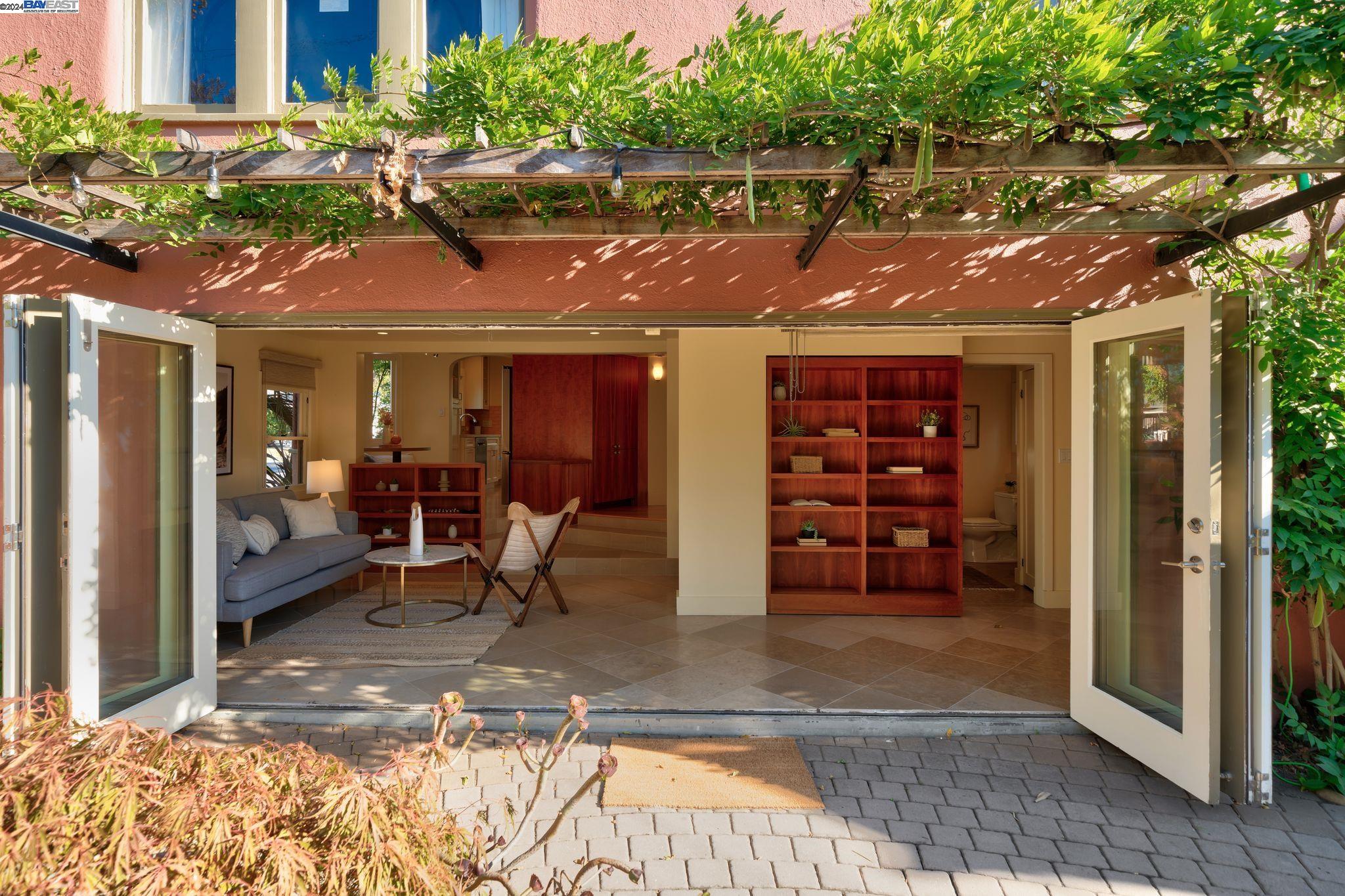 a view of a chairs and table in a backyard