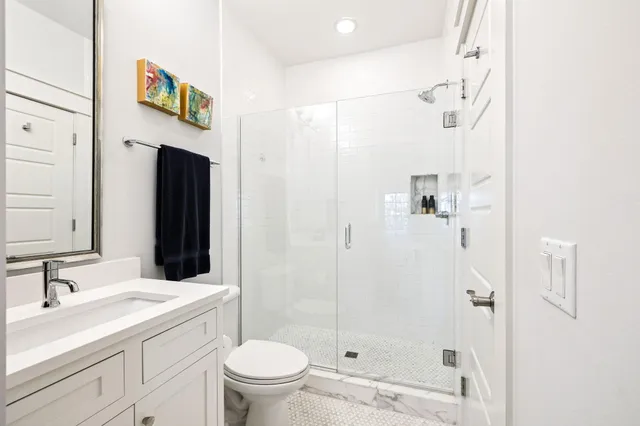 a living room with furniture a rug and a chandelier