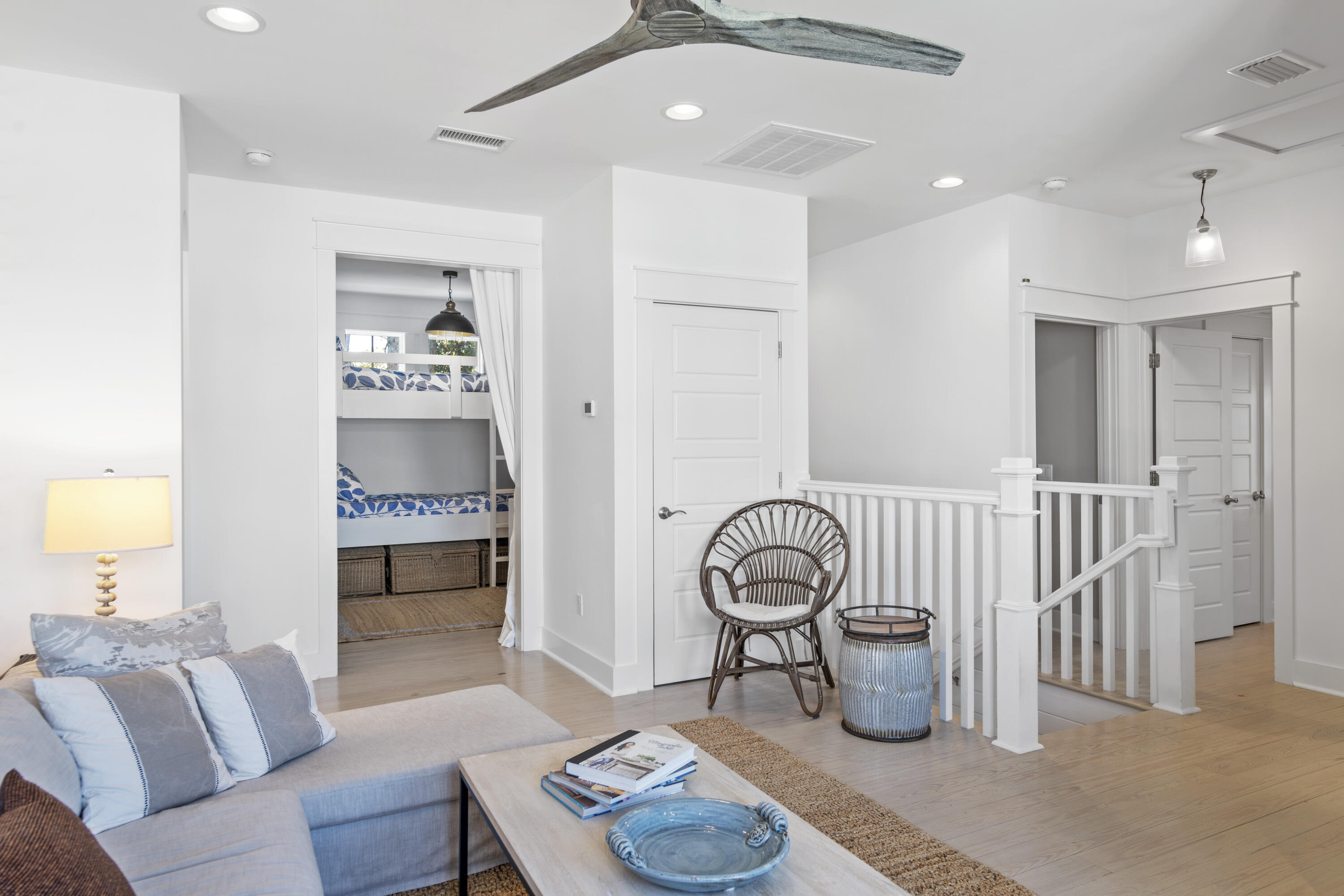 318 East Royal Fern Way Santa Rosa Beach, FL 32459 - Photo 28 of 43 a living room with furniture a rug and a chandelier