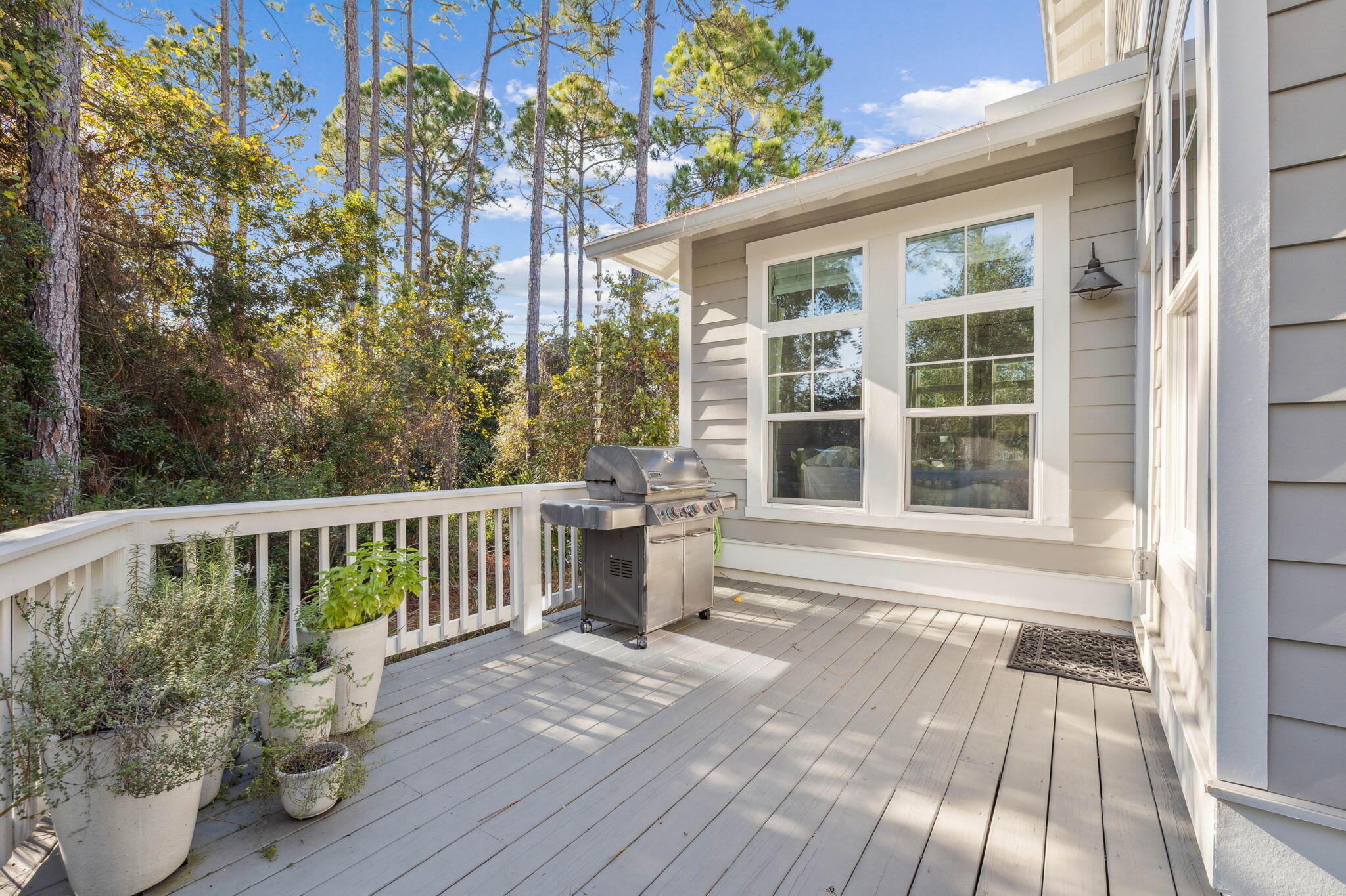 318 East Royal Fern Way Santa Rosa Beach, FL 32459 - Photo 34 of 43 a porch with seating space and yard
