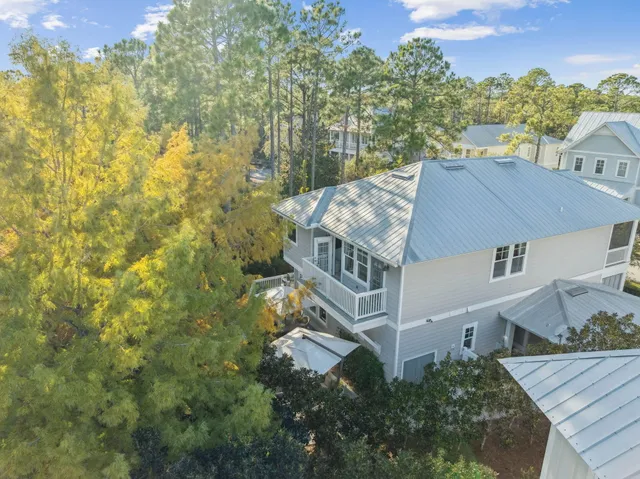 a view of a chairs and table on the wooden deck