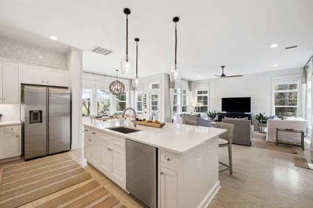 a view of a dining room with furniture large wooden floor and stuff