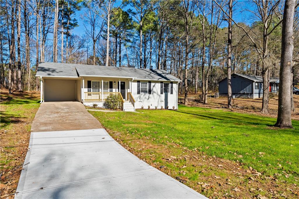 114 Vincent Avenue Stockbridge, GA 30281 - Photo 2 of 23 a front view of a house with garden