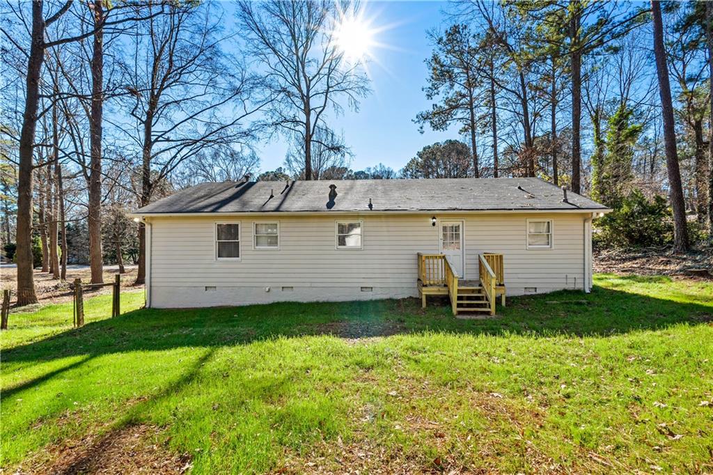 114 Vincent Avenue Stockbridge, GA 30281 - Photo 23 of 23 a backyard of a house with table and chairs