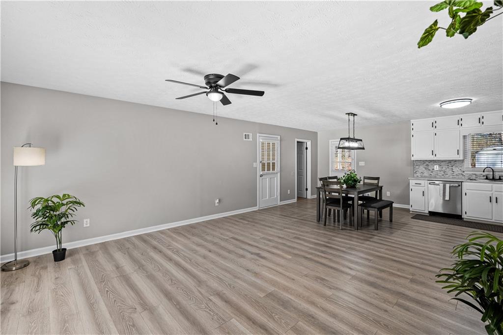 114 Vincent Avenue Stockbridge, GA 30281 - Photo 4 of 23 a view of dining room with furniture and a potted plant
