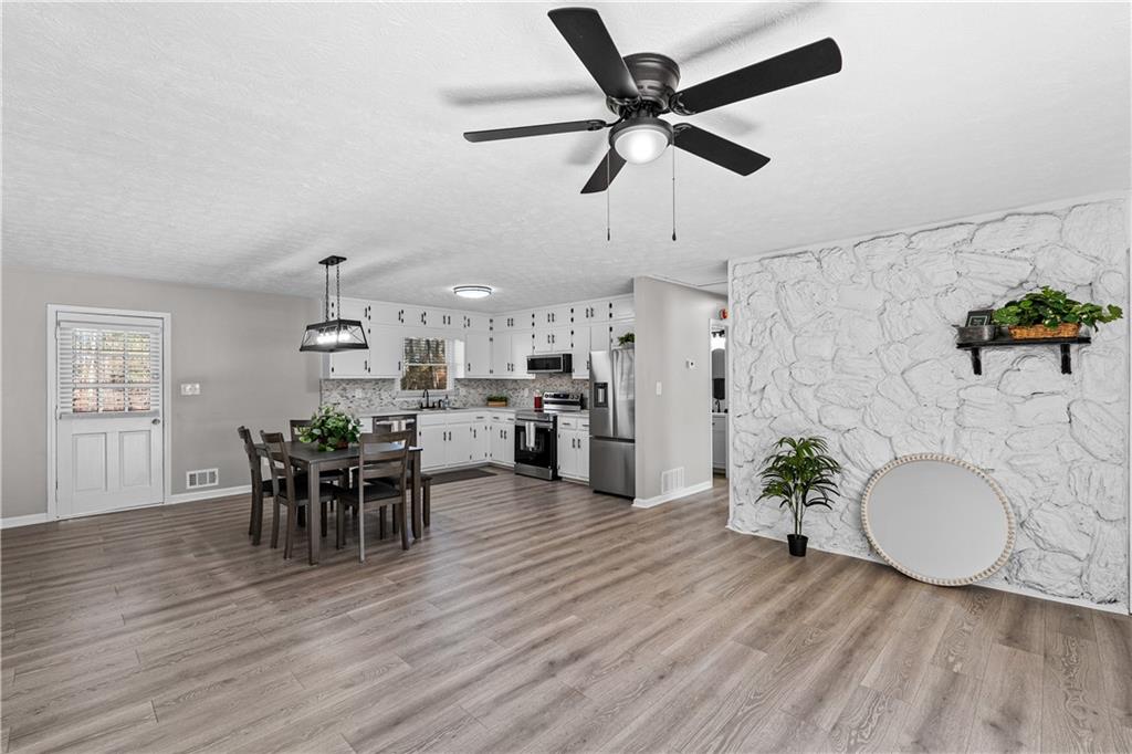 114 Vincent Avenue Stockbridge, GA 30281 - Photo 5 of 23 a view of a dining room with furniture and wooden floor
