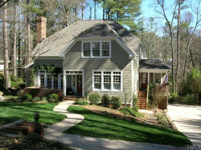 2718 Cambridge Road Raleigh, NC 27608 - Photo 1 of 12 a front view of a house with a yard