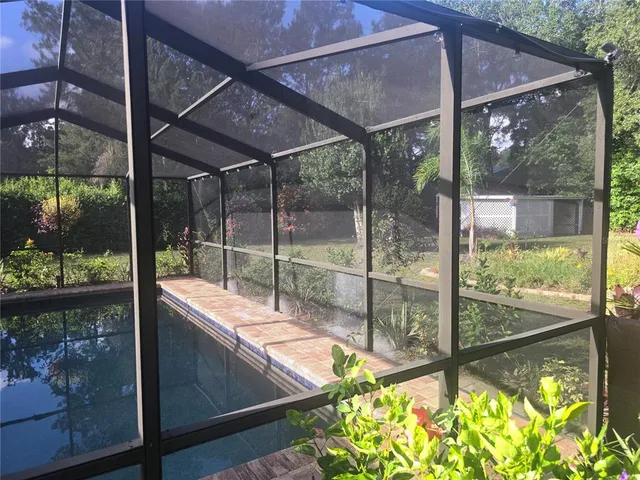 a view of a small yard with a patio