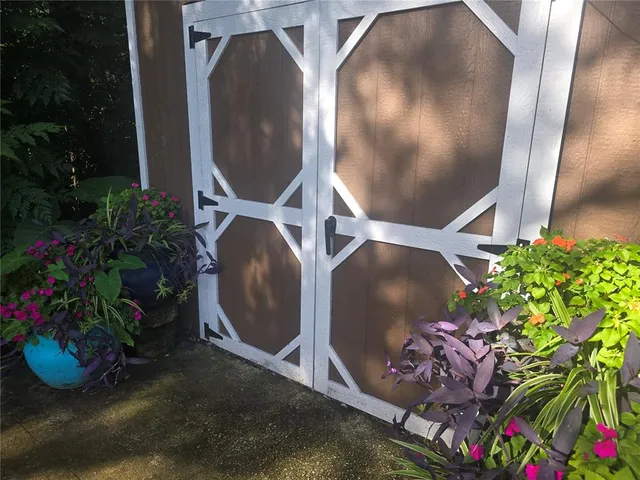 a view of storage and utility room with stairs