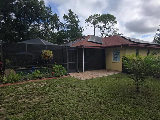 a backyard of a house with lots of green space
