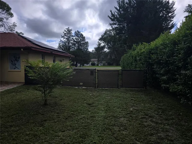 a backyard of a house with lots of green space