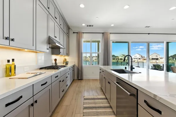 a kitchen with stainless steel appliances a stove and a refrigerator
