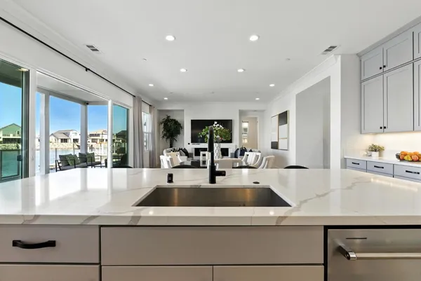 a kitchen with stainless steel appliances a refrigerator and a stove top oven