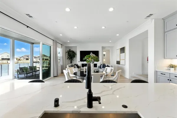 a large kitchen with stainless steel appliances lots of counter space and breakfast area