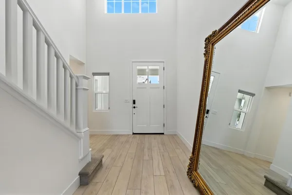 a white toilet sitting next to a white sink