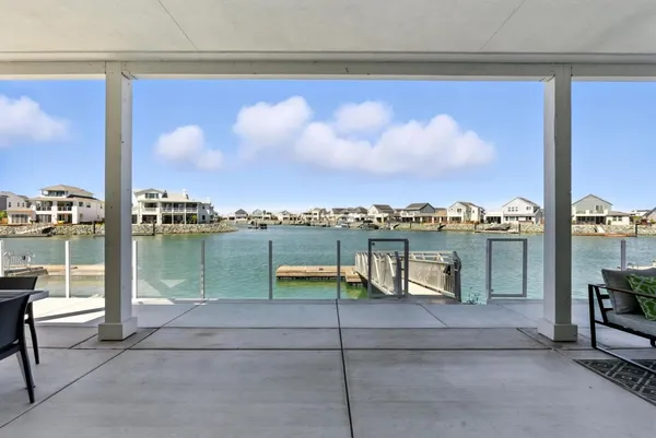 a living room with furniture a rug and a large window
