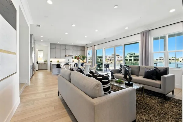 a large kitchen with stainless steel appliances granite countertop a lot of counter space and wooden floors