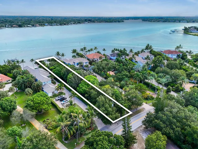 an aerial view of a house with a lake view