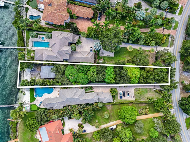 an aerial view of house with yard swimming pool and outdoor seating