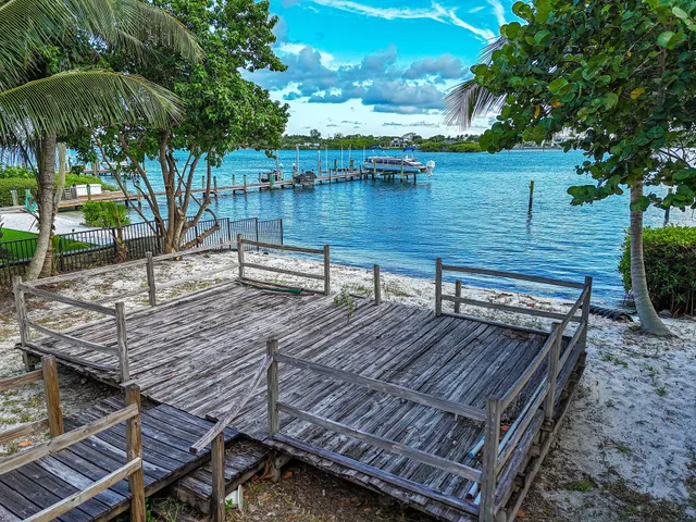 a view of a wooden deck with chairs