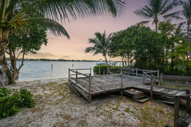 a view of a backyard with swimming pool