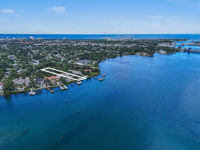 an aerial view of a houses with city view