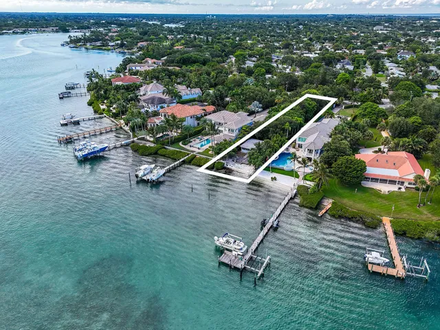 an aerial view of a house with a park