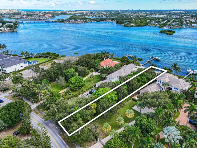 an aerial view of a house with a lake view