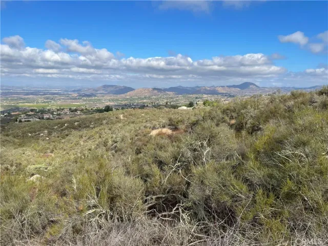a view of a city with mountains in the background