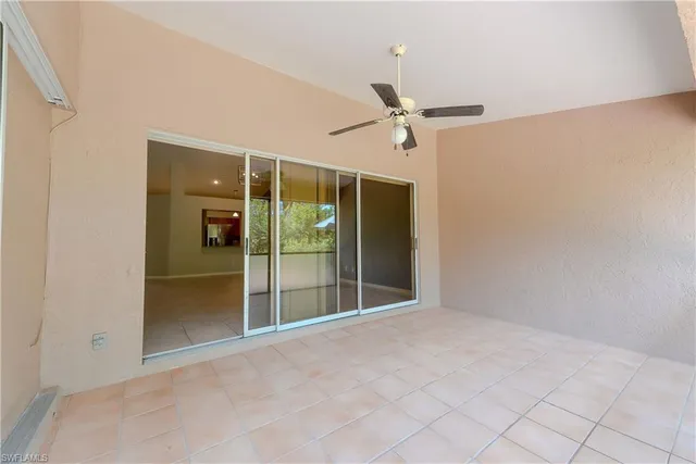 a view of an empty room with a fan