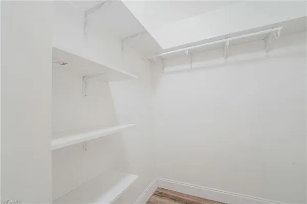 a view of an empty walk in closet