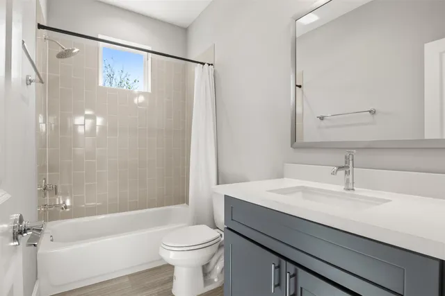 a bathroom with a sink a toilet and a bathtub