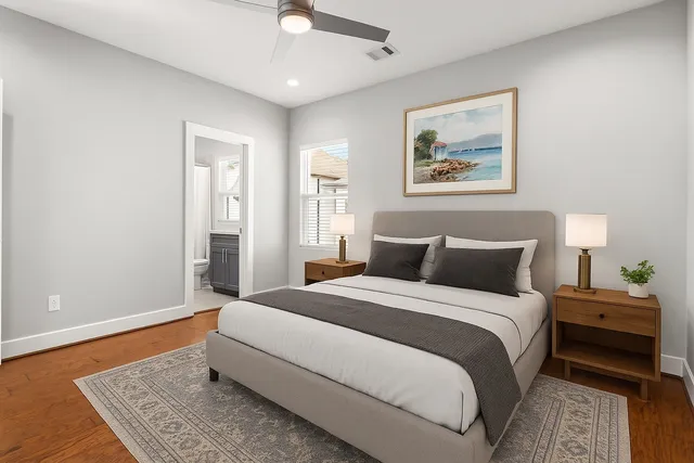 a spacious bedroom with a bed and a couch