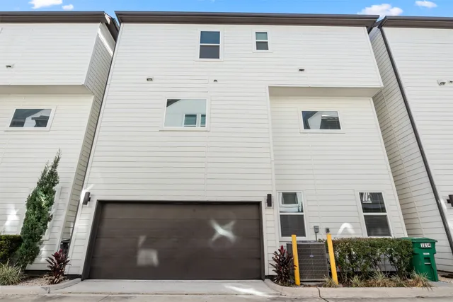 a view of a house with car parked