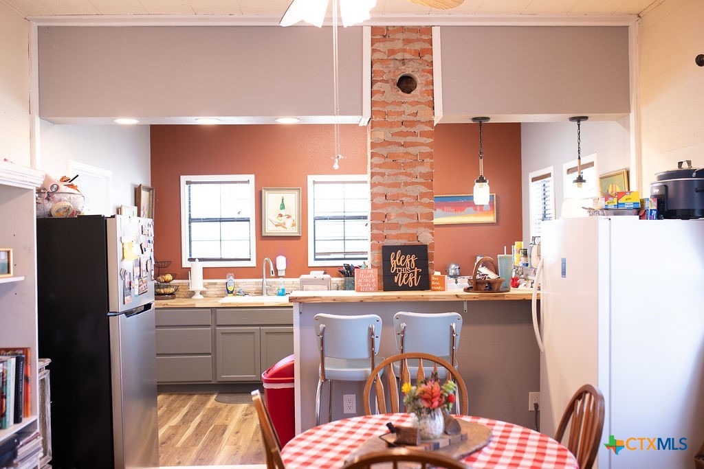 202 East 4th Street Nordheim, TX 78141 - Photo 3 of 18 a kitchen with a sink a stove a refrigerator and furniture