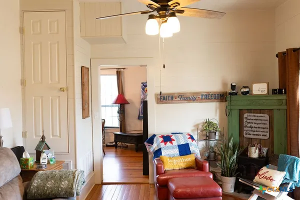 a living room with furniture and a flat screen tv