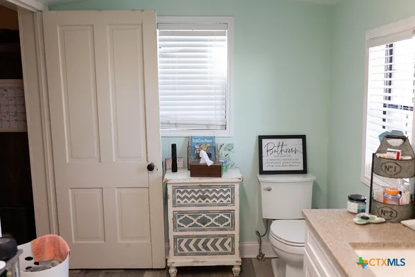 a bathroom with a toilet and a sink
