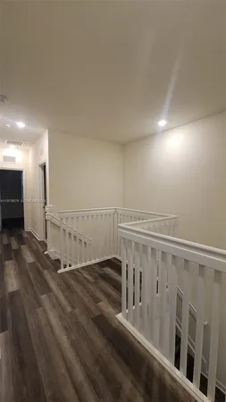 a view of entryway with wooden floor