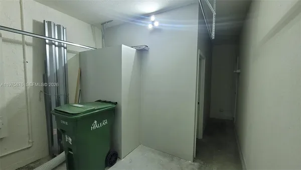 a bathroom with a shower and a mirror