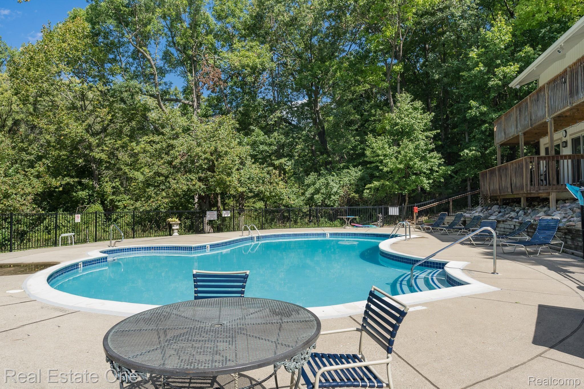 1677 Riverside Drive, Unit 16 Rochester, MI 48309 - Photo 26 of 31 BEAUTIFUL POOL WITH CLUBHOUSE FACILITIES ON THE RIGHT - 1677 Riverside MLS-W043.jpg