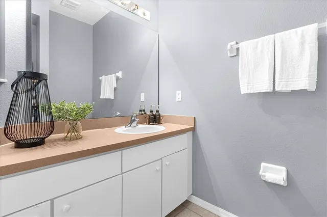 a bathroom with a toilet a sink and a window