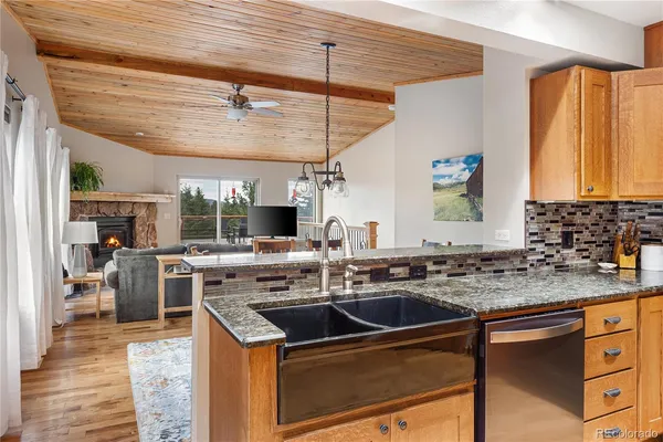a kitchen with a sink stove and cabinets