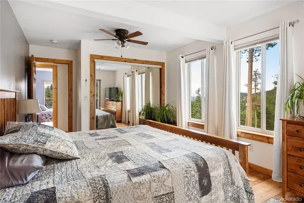 a bedroom with a large bed and a window